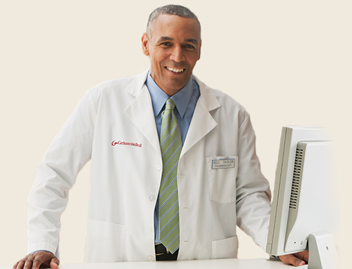 Pharmacist behind a desk